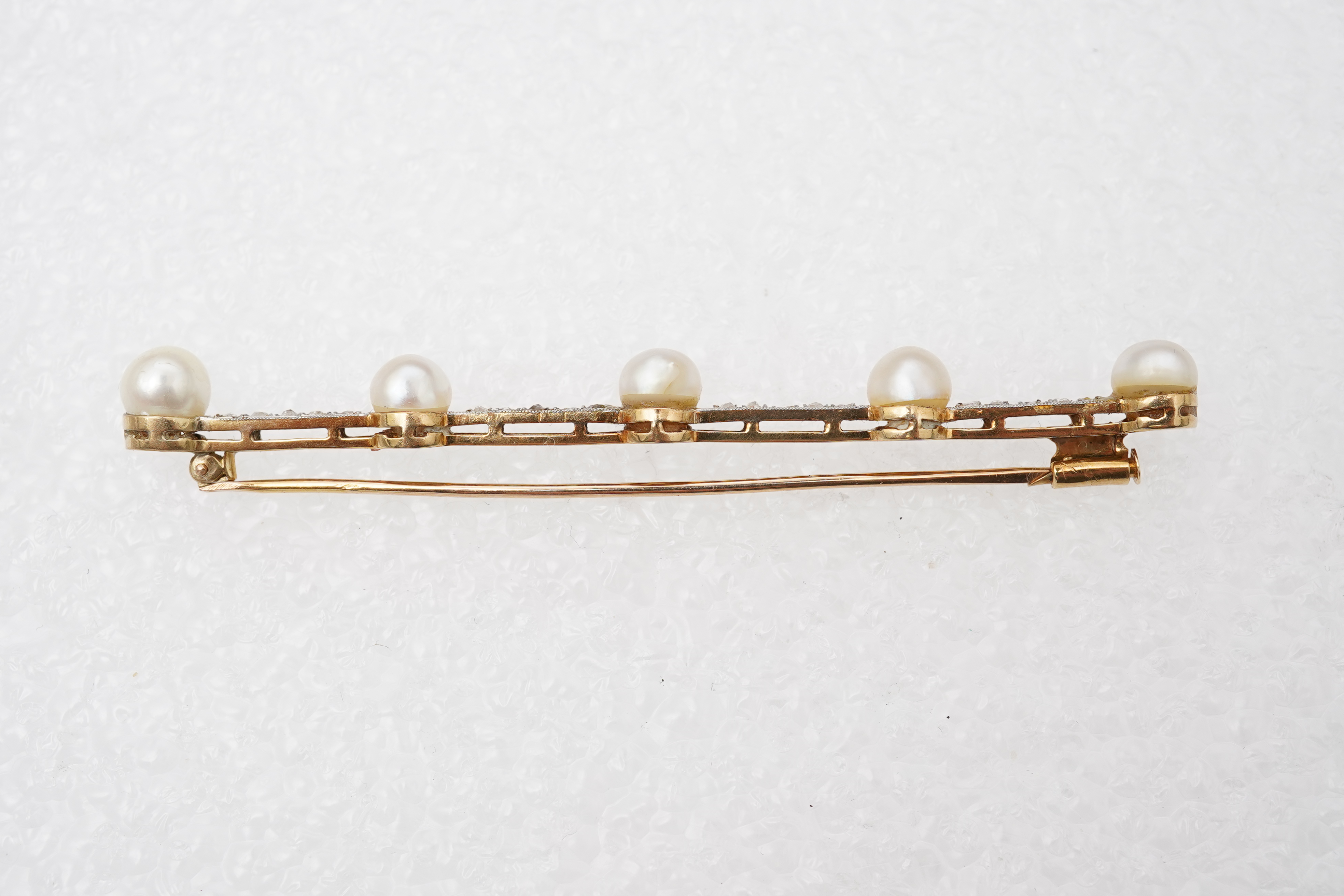 A pearl and diamond bar brooch, France, early 20th century